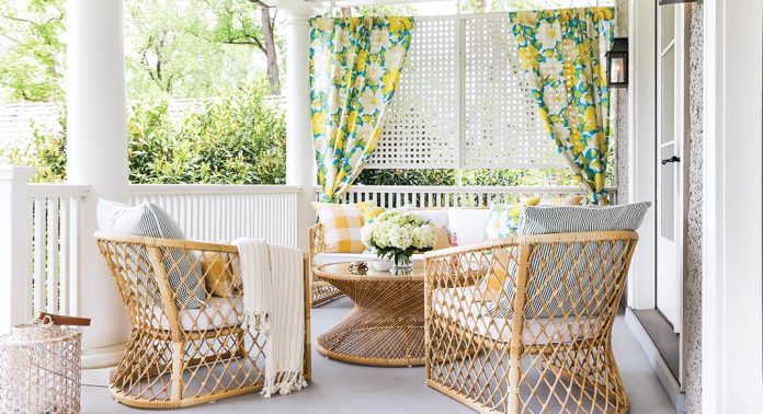 A seating area on the porch with white, yellow, and green accents.