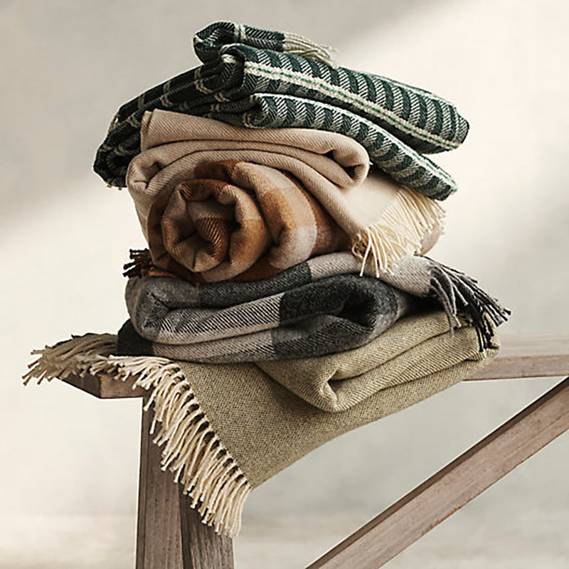 A stack of merino wool throws.