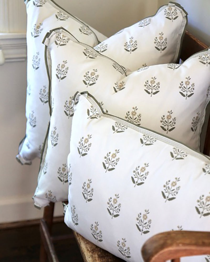Pillows with a botanical bock-print pattern.