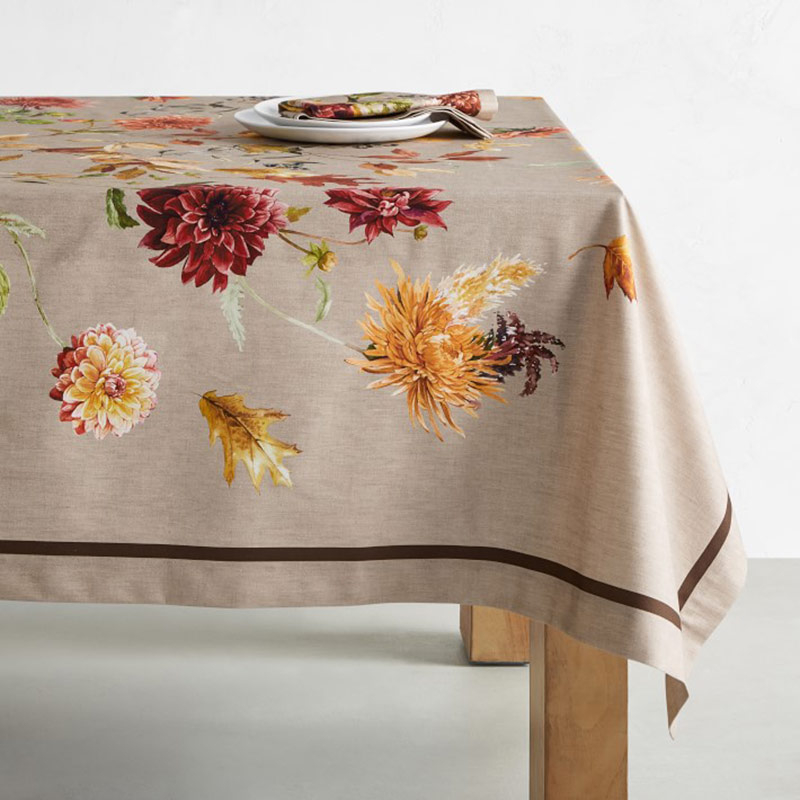 A tablecloth featuring dahlias.