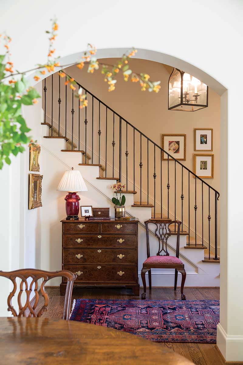 foyer with dee purple rug and antique chest