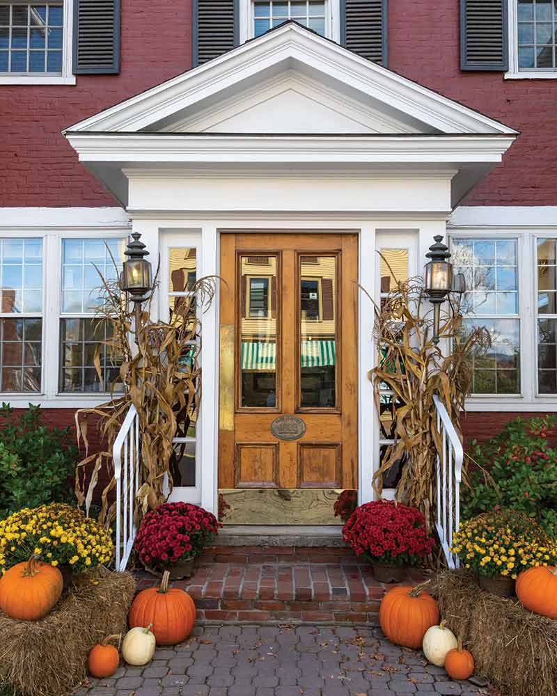 Autumn front door decorated with pumpkins in Vermont