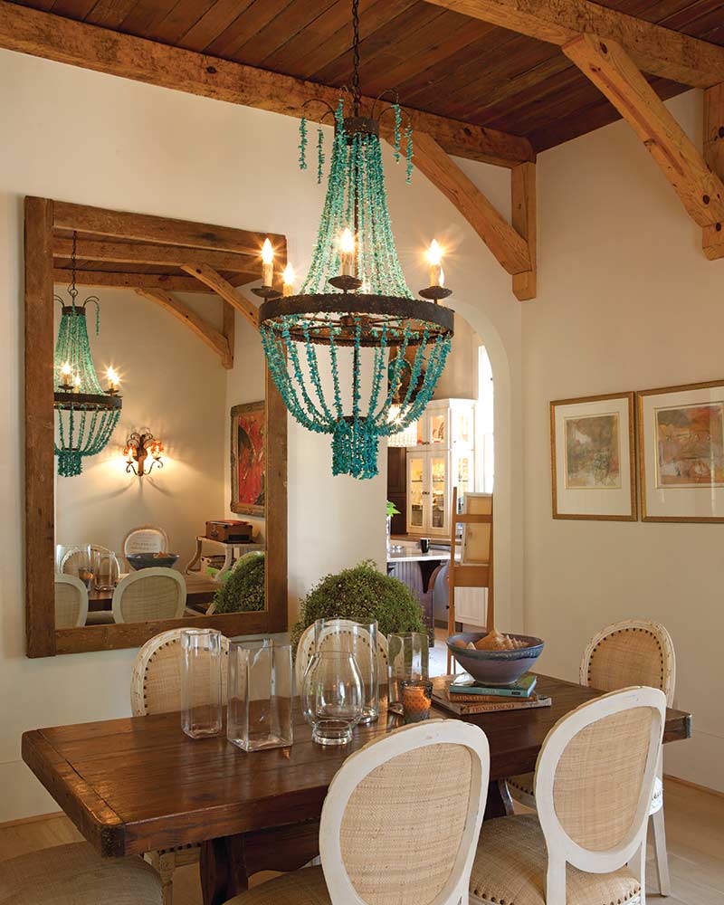 cottage dining room with teal beaded chandelier