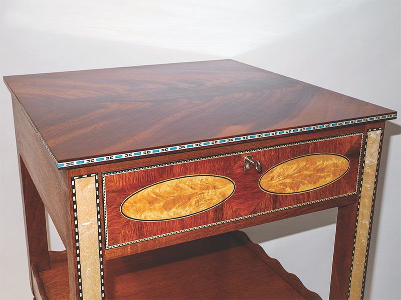 A Boardman design table that is a reproduction of a ladies' worktable made in 1815. 