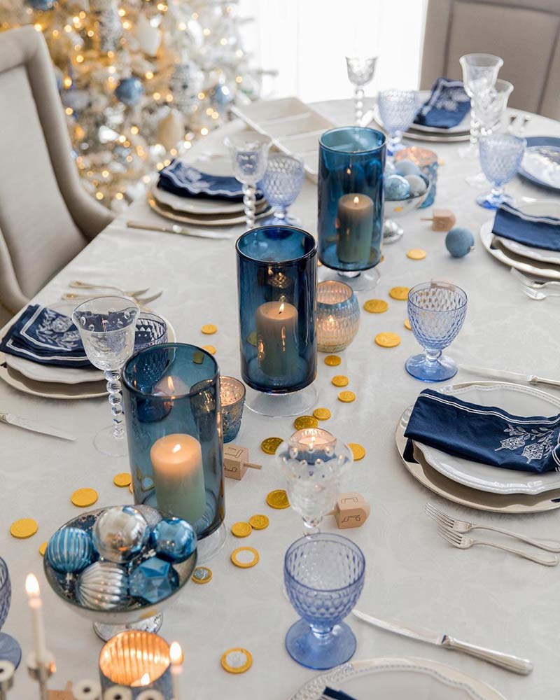 A Hanukkah tablescape with blue and gold accents. 