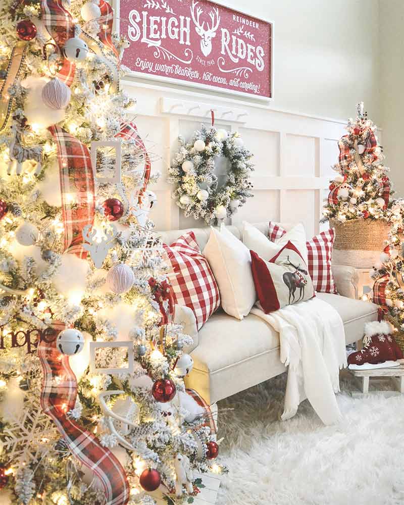 A living room with red-and-white holiday decor. 