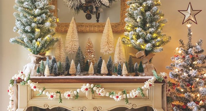 A Christmas tabletop vignette with bottlebrush trees.