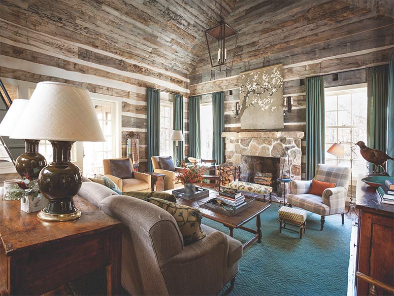 A rustic-style living room accented with blue and warm brown tones. 