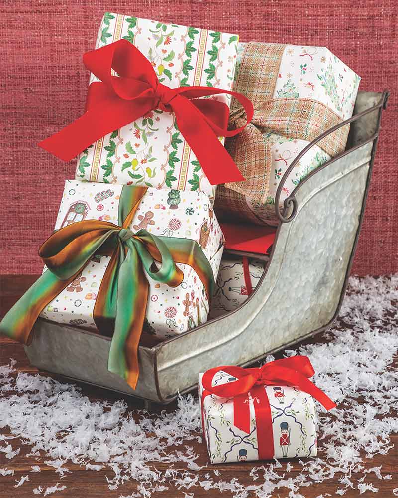 A collection of presents in a galvanized metal sleigh. 