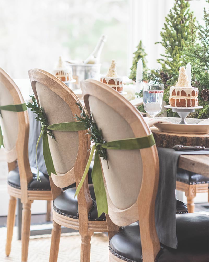 A woodland-inspired holiday tablescape accented with fresh greenery. 