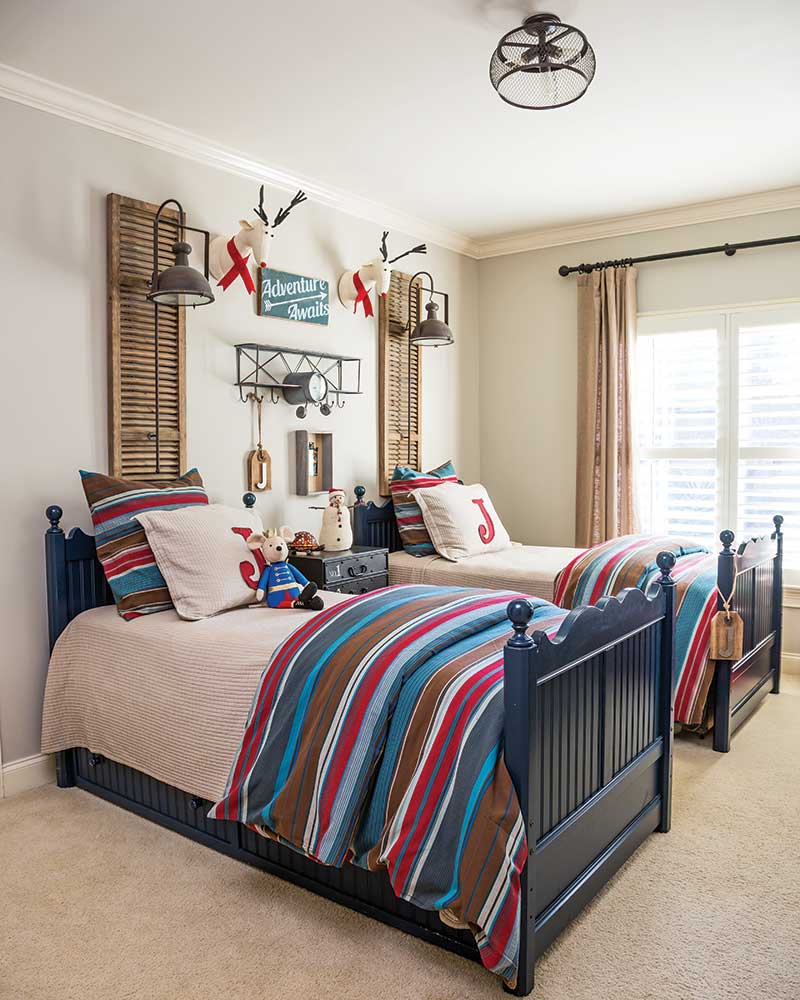 A bedroom with two twin beds and festive accents.