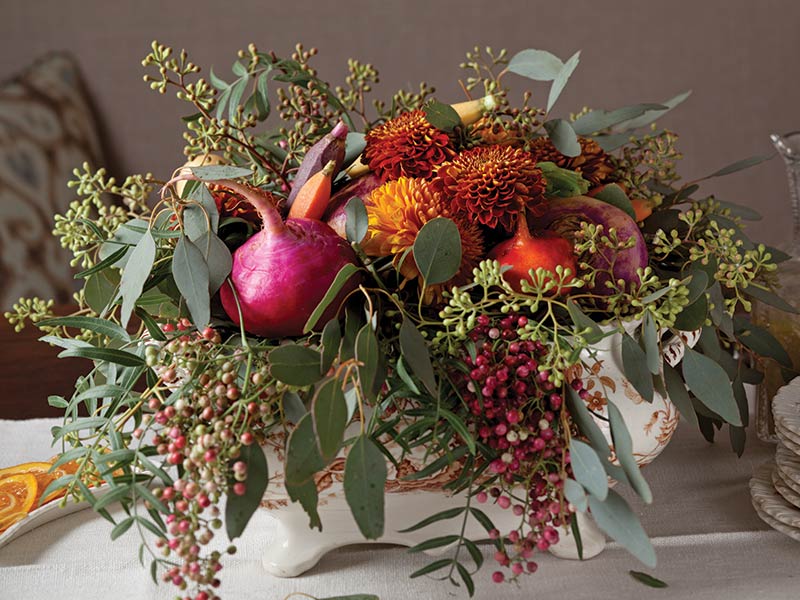 A floral arrangement featuring radishes. 