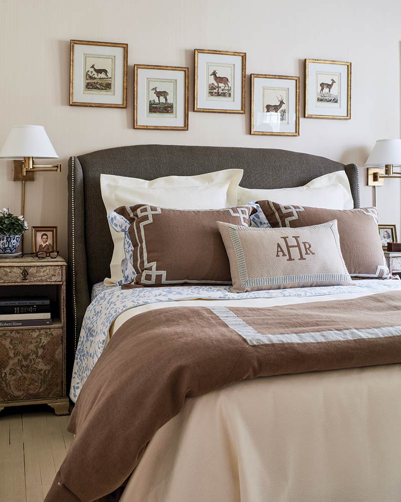 A master bedroom decorated in warm taupes and chocolate browns.
