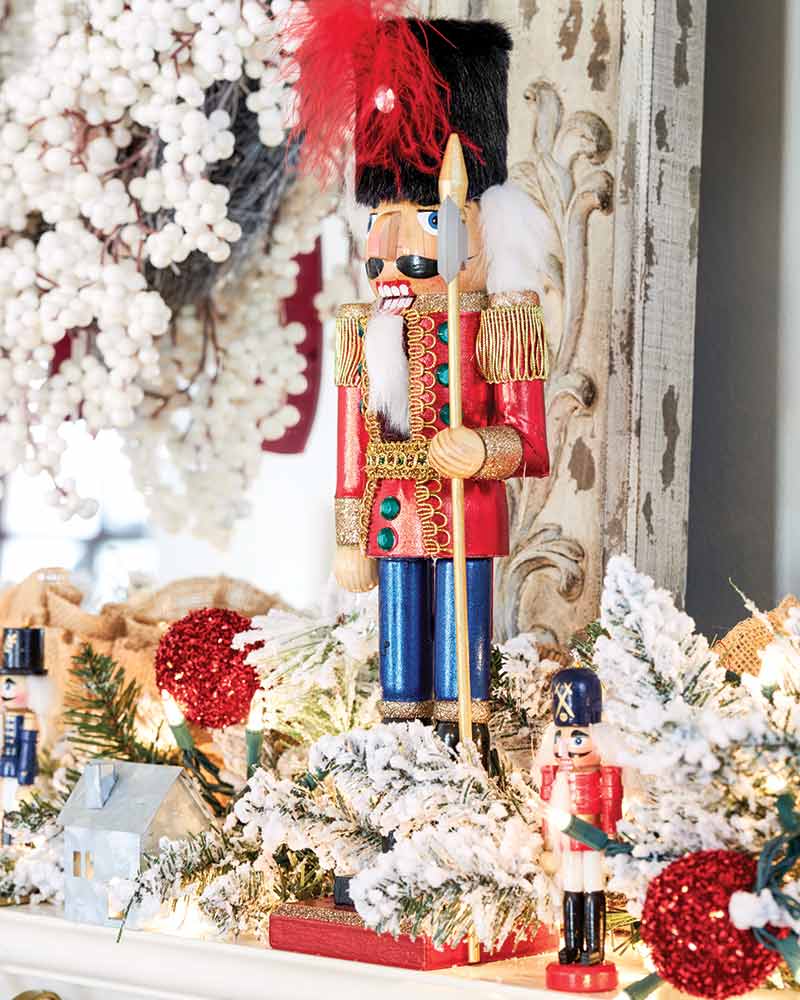 A collection of Nutcrackers displayed on the mantel.