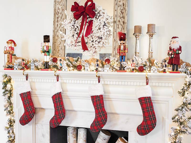 Plaid stockings on a mantel featuring Nutcrackers.