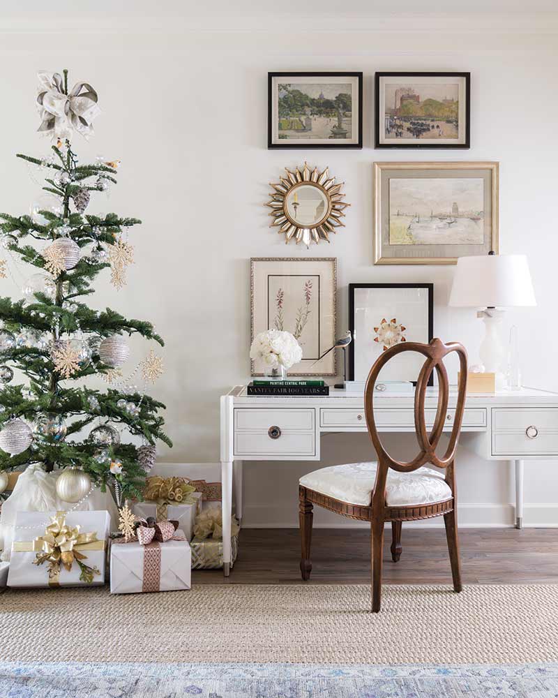 An airy tree next to a white writing desk. 