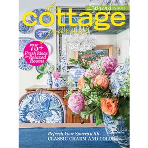 Cottage Journal Spring 2022 Cover Featuring Blue and White Table Spread and Multi-colored Flowers.