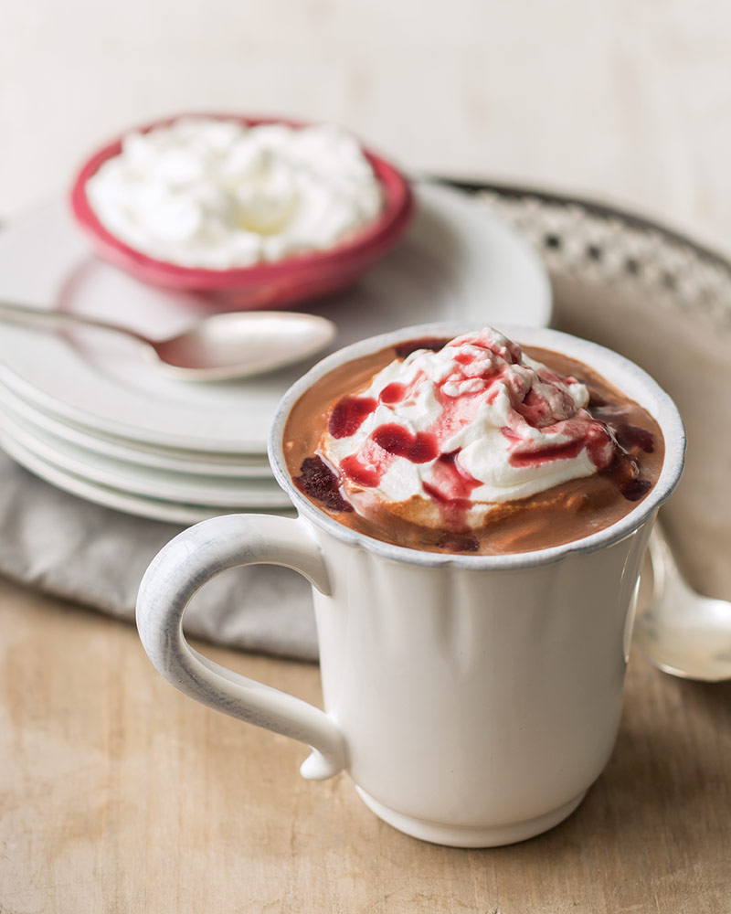A white mug of Dark Chocolate Covered Cherry Hot Chocolate