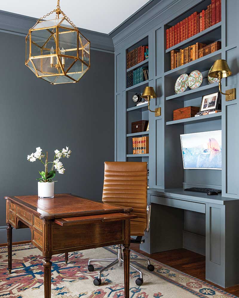 A steel blue office with rich wood furnishings and warm leather accents.