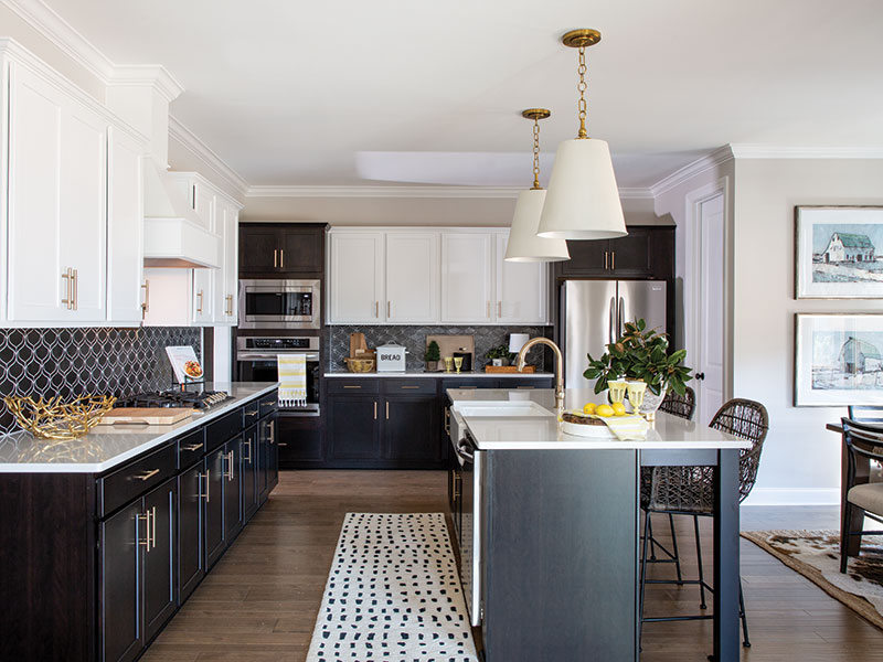 A tuxedo kitchen with a contemporary black-and-white backsplash.