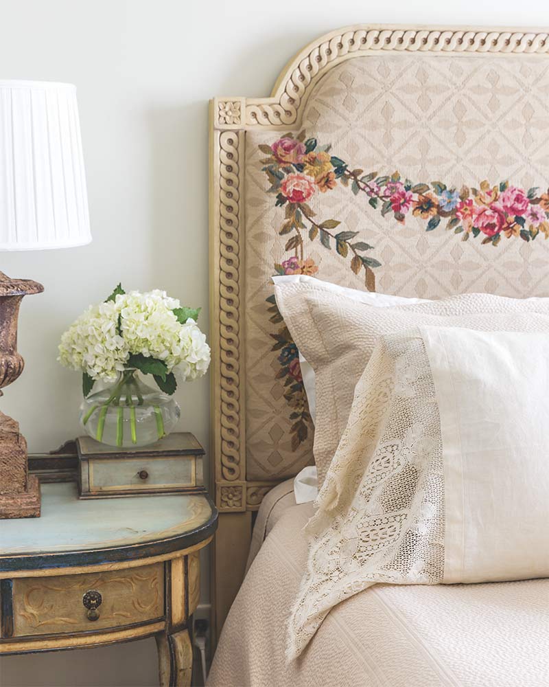 A headboard with floral embellishments.