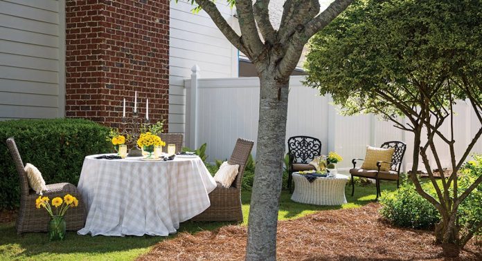 An alfresco tablescape and outdoor sitting area.