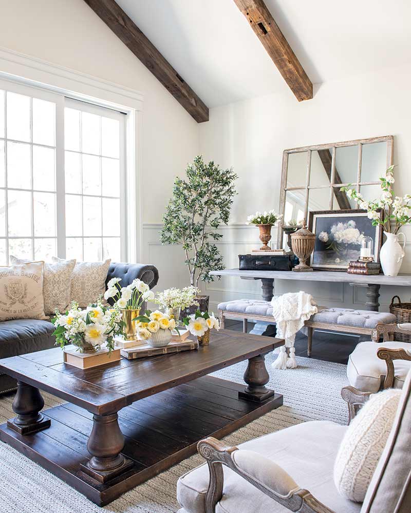 A living room with vaulted ceilings and French-inspired furnishings.