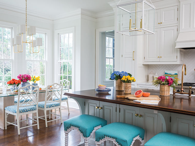 A white kitchen with aqua accents.