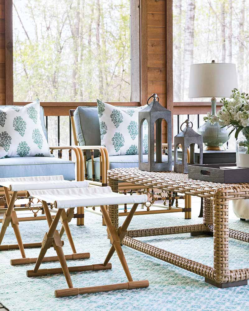A sitting area in a screened porch for indoor/outdoor entertaining.