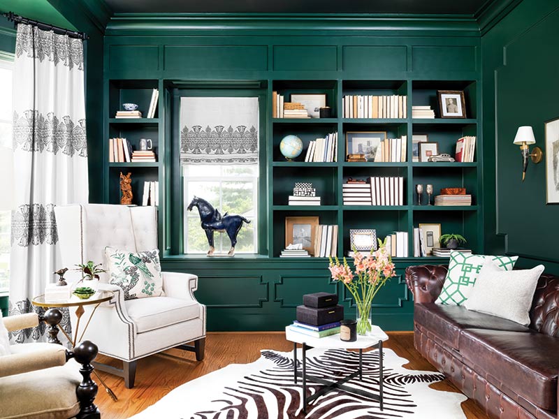 A library painted forest green.