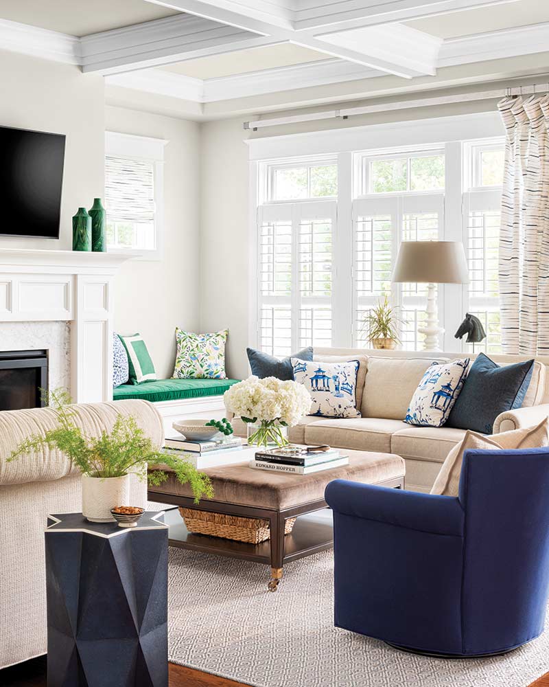 A living room with blue and kelly green accents.