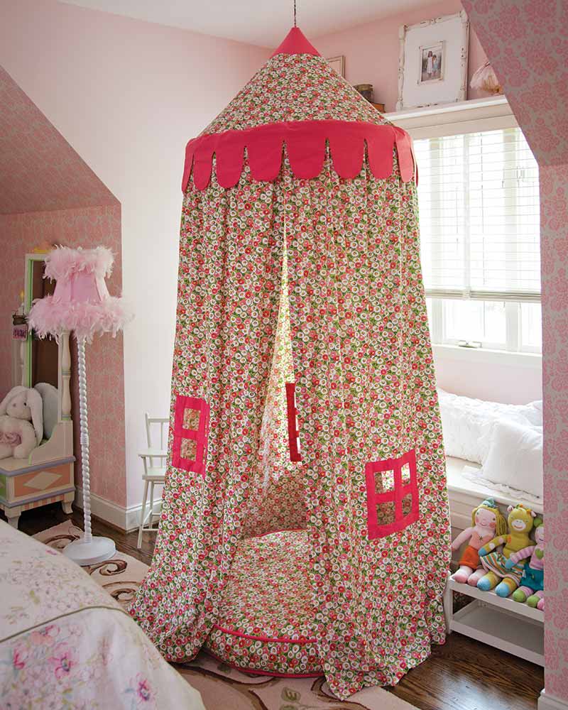 A pink floral hanging tent. 