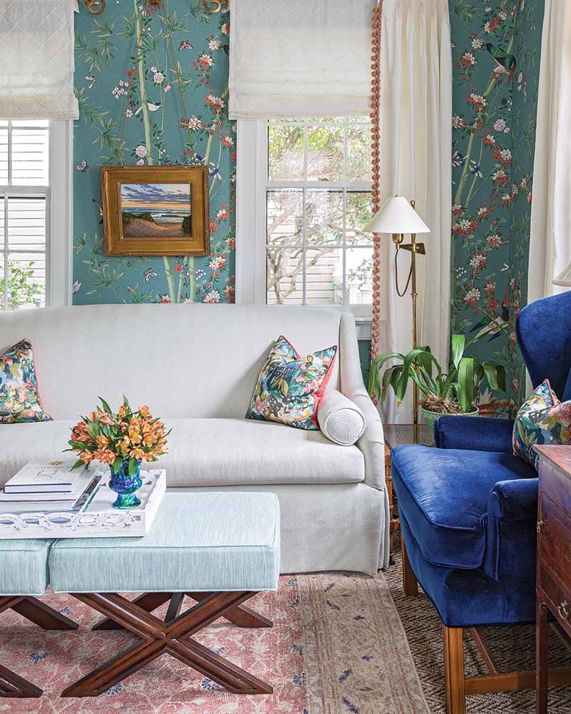 South Carolina Home - Living Room with floral wallpaper, blue reading chair, white couch