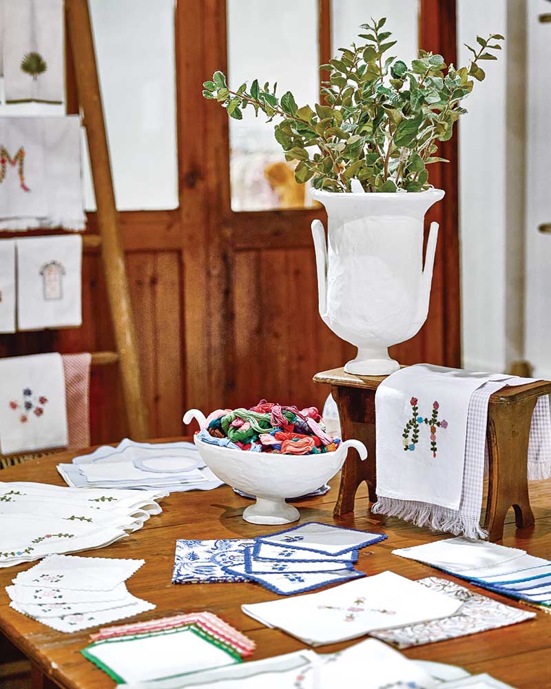 embroidered linens on a table.