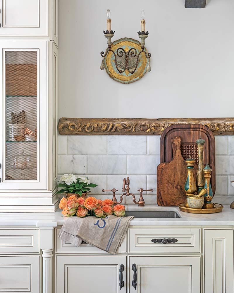 A kitchen with antique pieces.