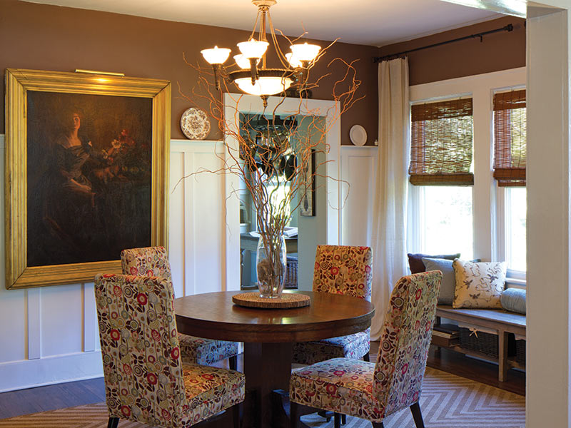 Dining room with bay windows and portrait
